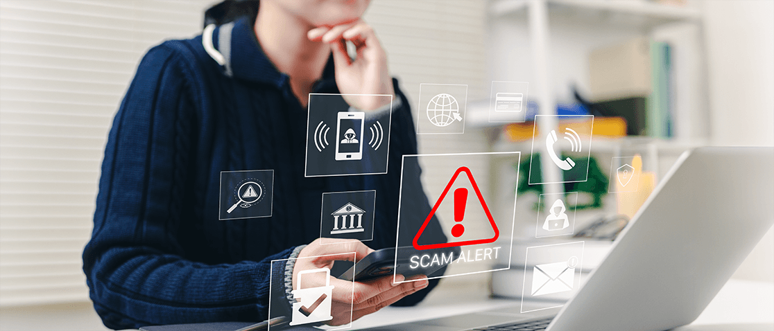 Woman scrolling on her laptop with scam and fraud alert pop ups surrounding her.